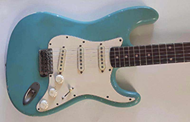 Stratocaster body in blue with white pick guard.
