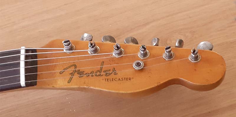 With Fender Telecaster logo