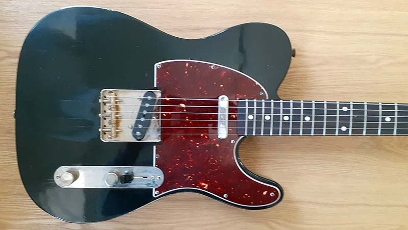 Black body with brown pick guard.